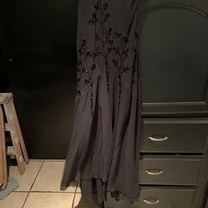 Beautiful Long dress with black flowers and nice skirt drop. Used it once
